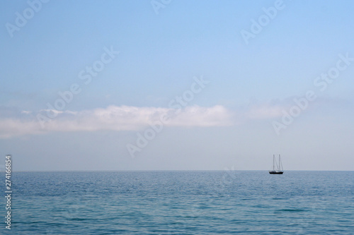 Lonely yacht in the calm blue sea