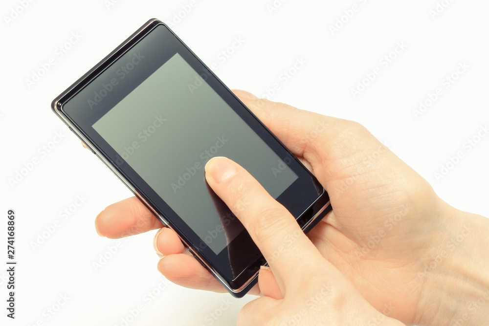Hand of woman holding smatphone and touching blank screen