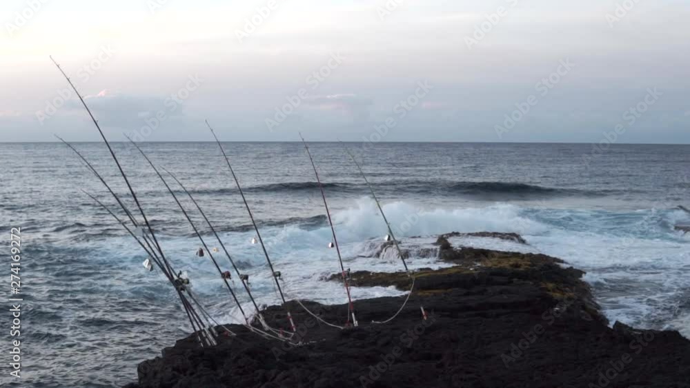 waves breaking while fishing for giant trevally or ulua in hawaii, captured in slow motion. waves breaking while fishing for giant trevally or ulua in hawaii, captured in slow motion.