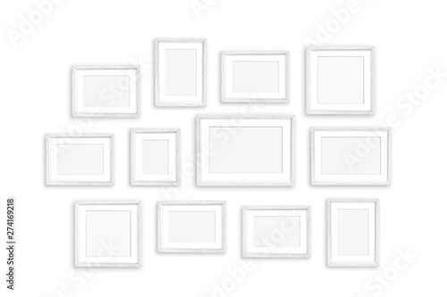 Photo frames collage, twelve blank white painted realistic frameworks isolated on white wall, interior decor mock up