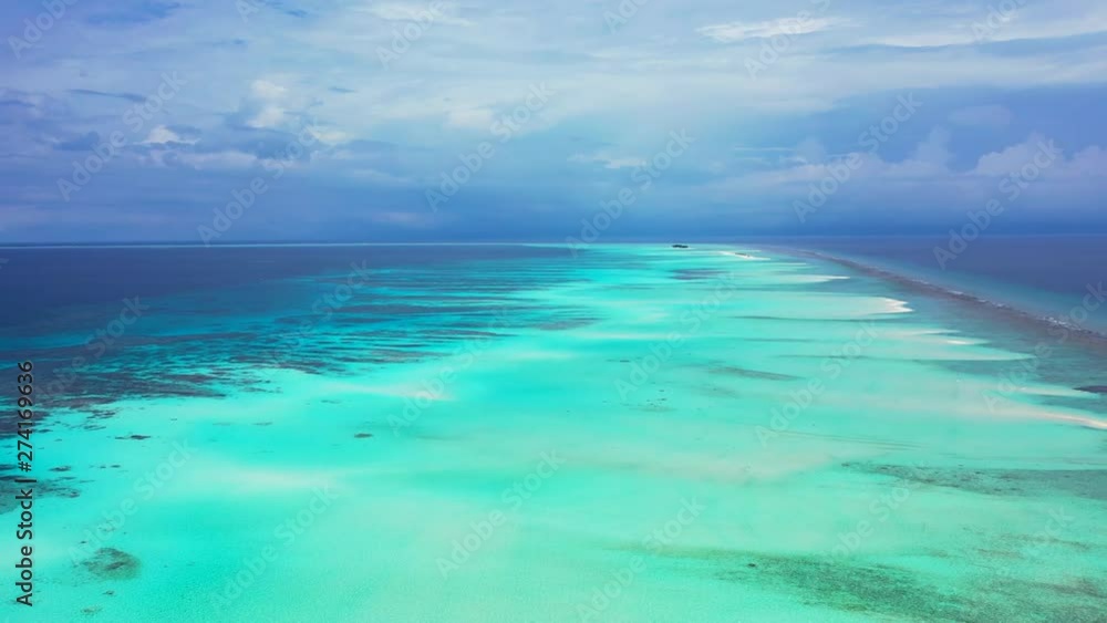maldives aerial shot with drone moving backwards of crystal clean ocean water maldives aerial shot with drone moving backwards of crystal clean ocean water