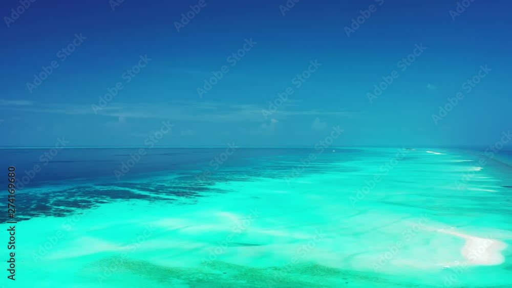 caribbean aerial shot of tropics crystal clean ocean waer with waves