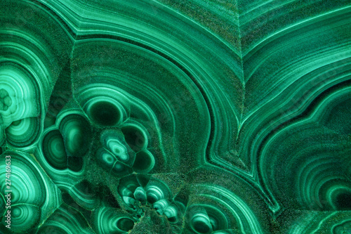 The green malachite. An ornamental stone. Photo texture. Macro.