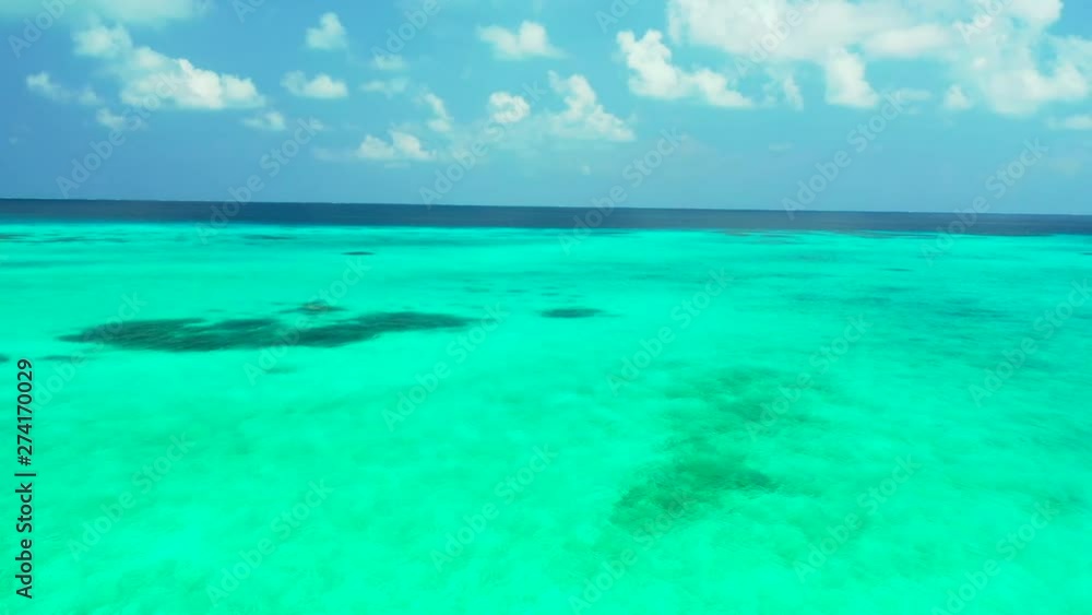 aerial drone shot of stunning turquise ocean water near tropical islands maldives aerial drone shot of stunning turquise ocean water near tropical islands maldives