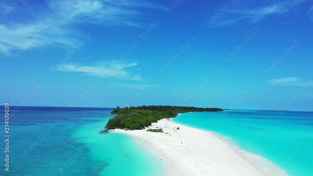 small tropical island on the middle of crystal clean ocean water around and palms on exotic island drone aerial footage maldives small tropical island on the middle of crystal clean ocean water around and palms on exotic island drone aerial footage maldives