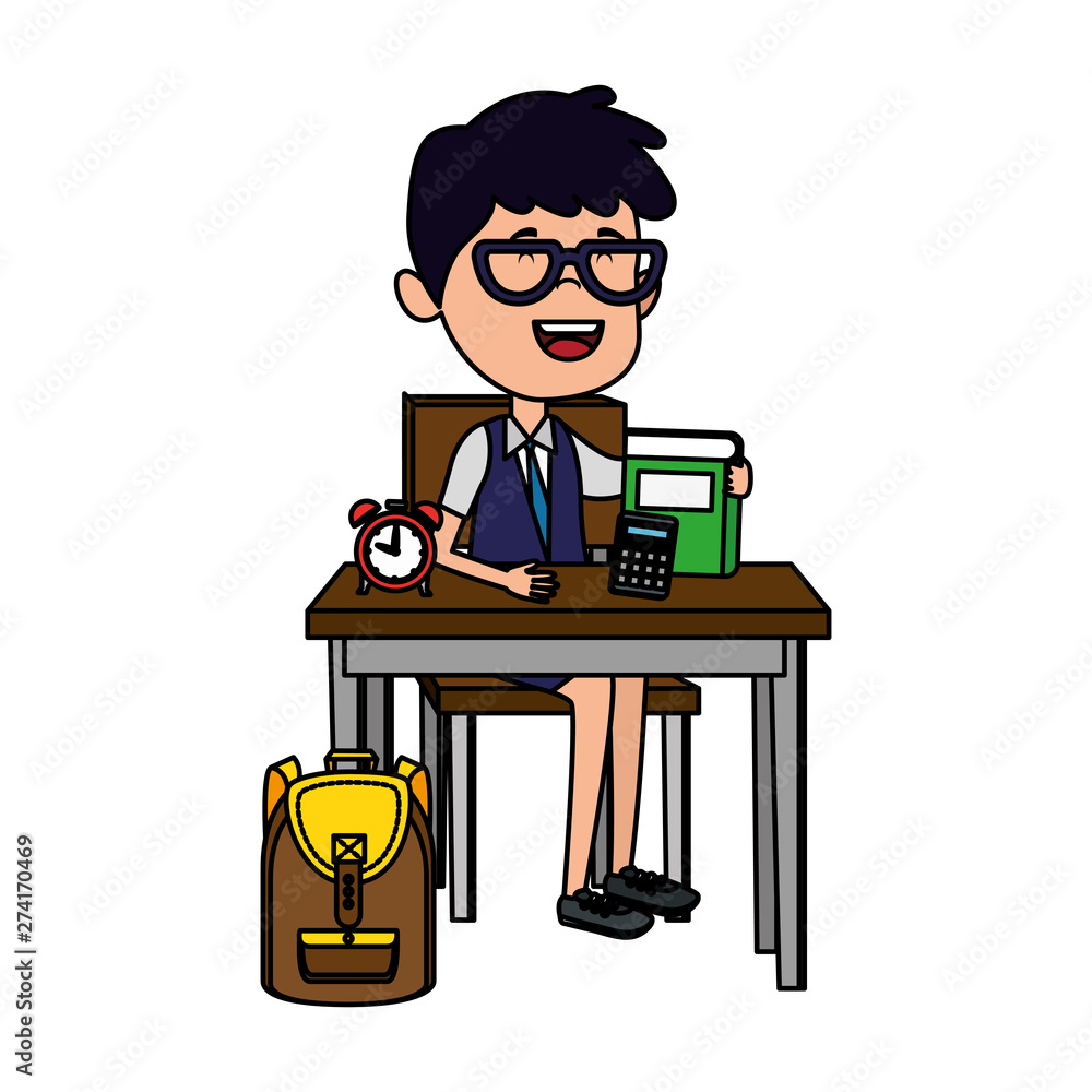 happy student boy with supplies seated in school desk