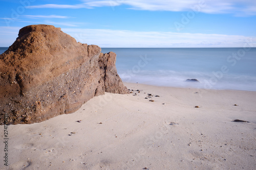 Crashing waves and rising water levels cause massive erosion on a New England beach