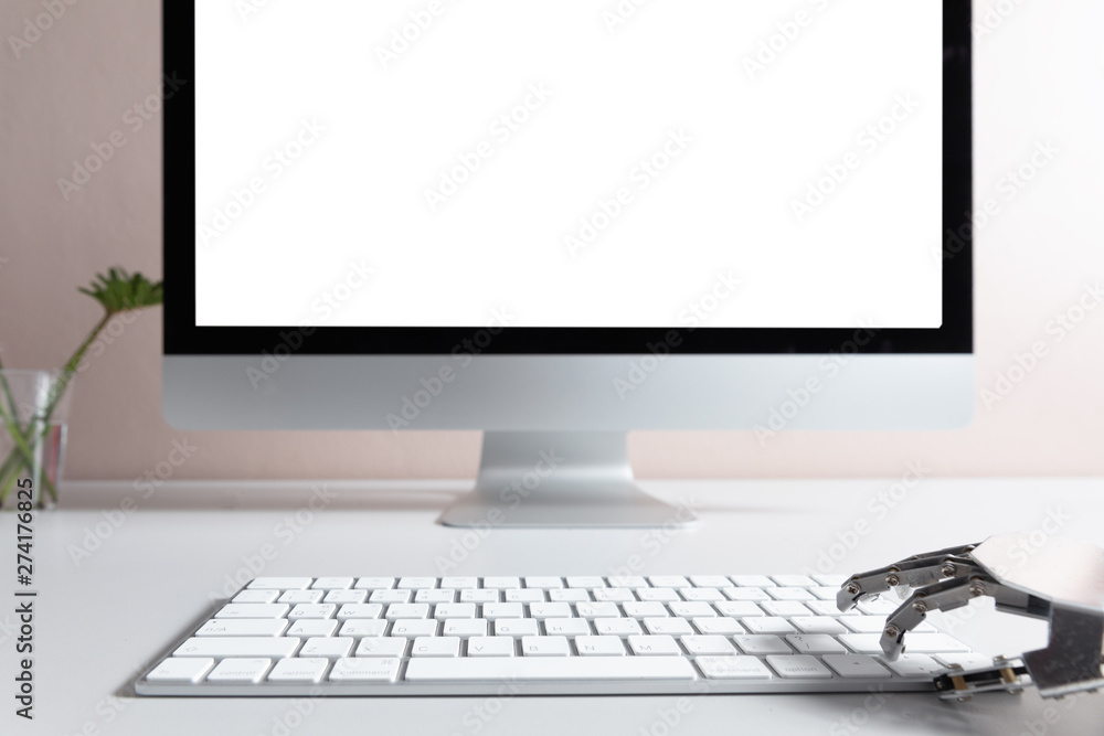 Fototapeta premium Robot hand, ordering on a laptop keyboard, an exchange trade. Robot trading system is a computer trading program that automatically submits trades to an exchange without any human interventions.
