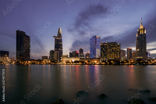 The best of night view in Ho Chi Minh City, Vietnam. Colorful of city light beside the Saigon river with skyline at sunset. Royalty high quality free stock image.