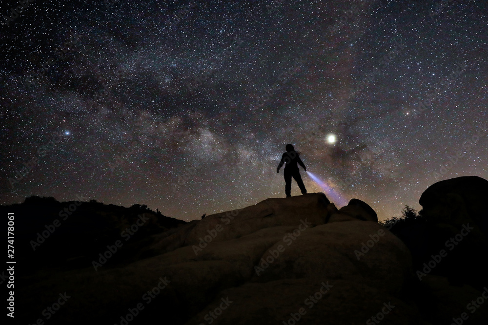 Person Light Painted in the Desert Under the Night Sky