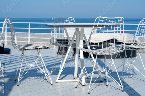 Table and chairs in a beach cafe on the shore near the sea in Batumi  Georgia