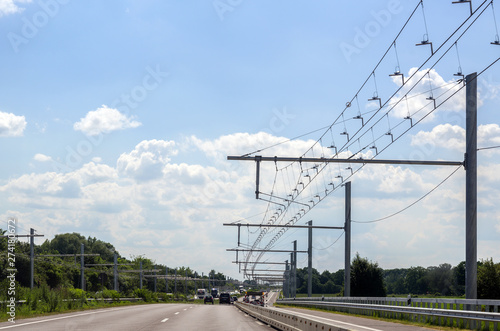 Test track with electric overhead contact wire for hybrid trucks on E-Highway in Luebeck, Germany, copy space