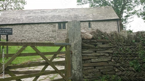 The Chapel of Saint Piran is a long construction in Trethevy, in the anglican parish of Tintagel in Cornwall, Uk. A church surrounded by farm buildings and converted barns. Zoom in 4k footage photo