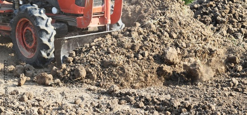 Wallpaper Mural tractor push clot soil after pour from truck Torontodigital.ca