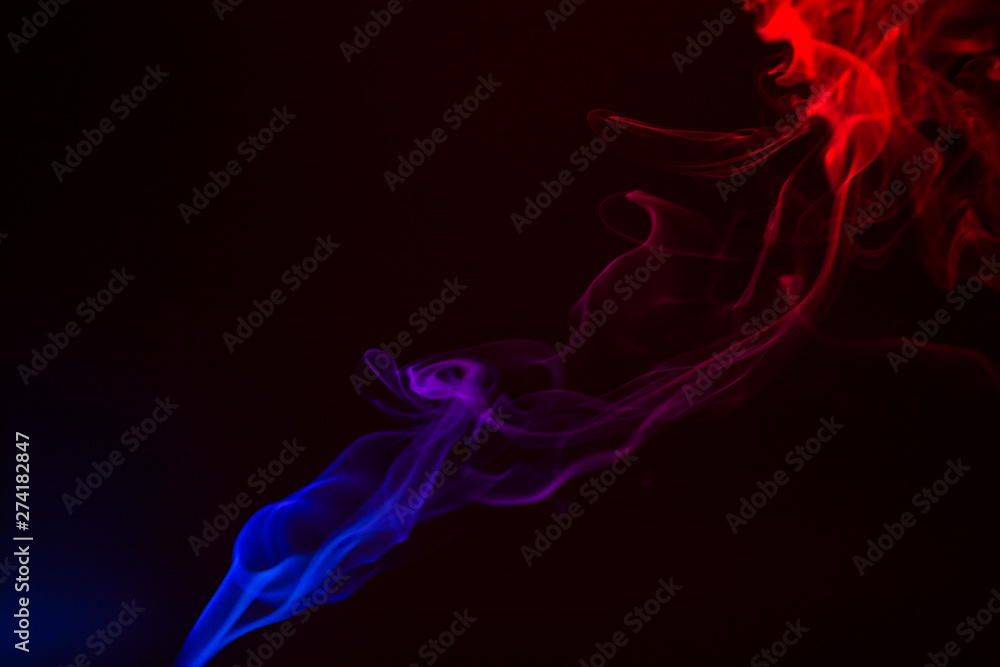 Fototapeta premium Colorful smoke close-up on a black background
