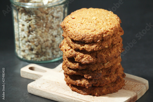 Homemade oatmeal cookie at dark background