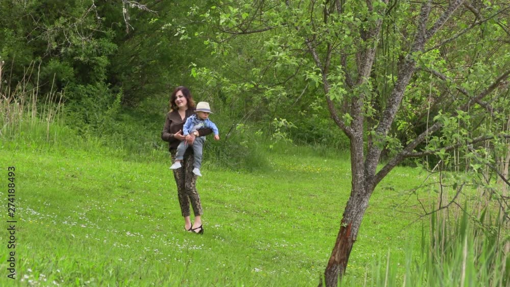 Mom walks with her little son Mom walks with her little son