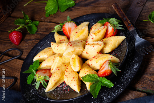 Kopytka - polish potato dumpling with strawberries photo