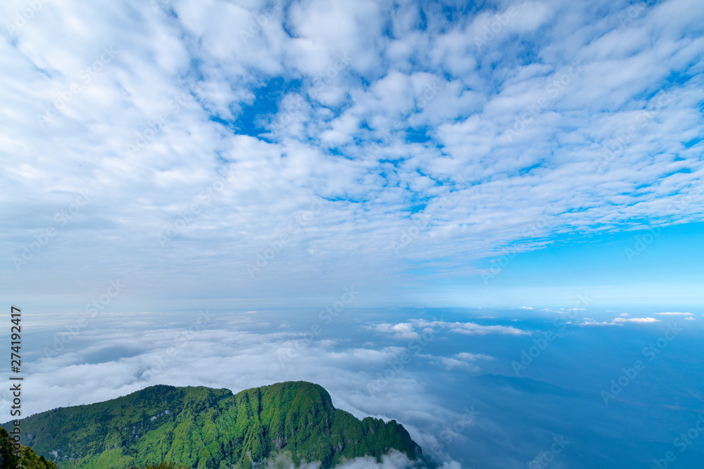 Peaks and seas of clouds under blue sky and white clouds, Emei Mountain, Sichuan Province, China Peaks and seas of clouds under blue sky and white clouds, Emei Mountain, Sichuan Province, China