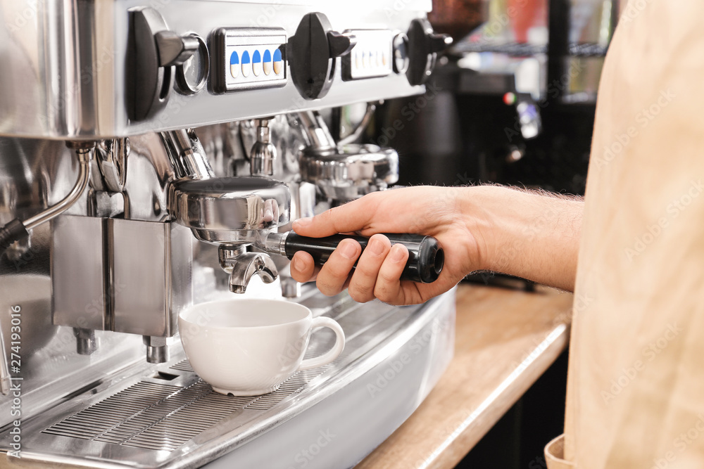 Barista preparing fresh aromatic coffee in cafe Barista preparing fresh aromatic coffee in cafe