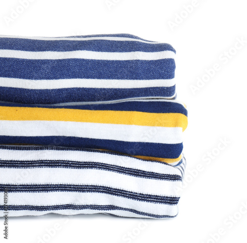 Stack of striped clothes on white background