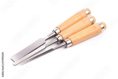 a set of chisels with wooden handle isolated .