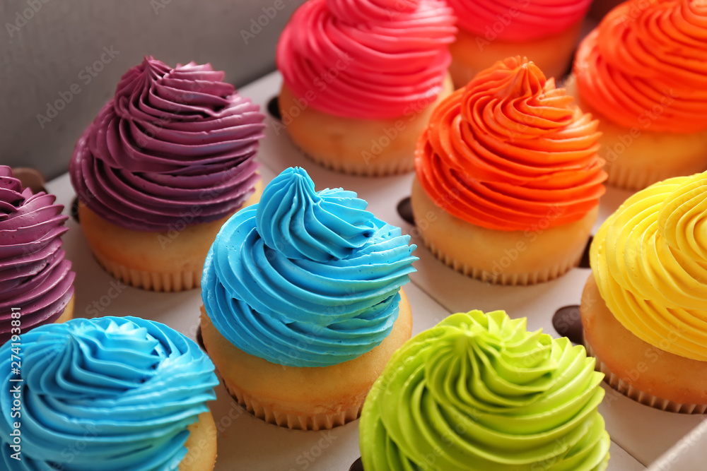 Many tasty colorful cupcakes in box Many tasty colorful cupcakes in box