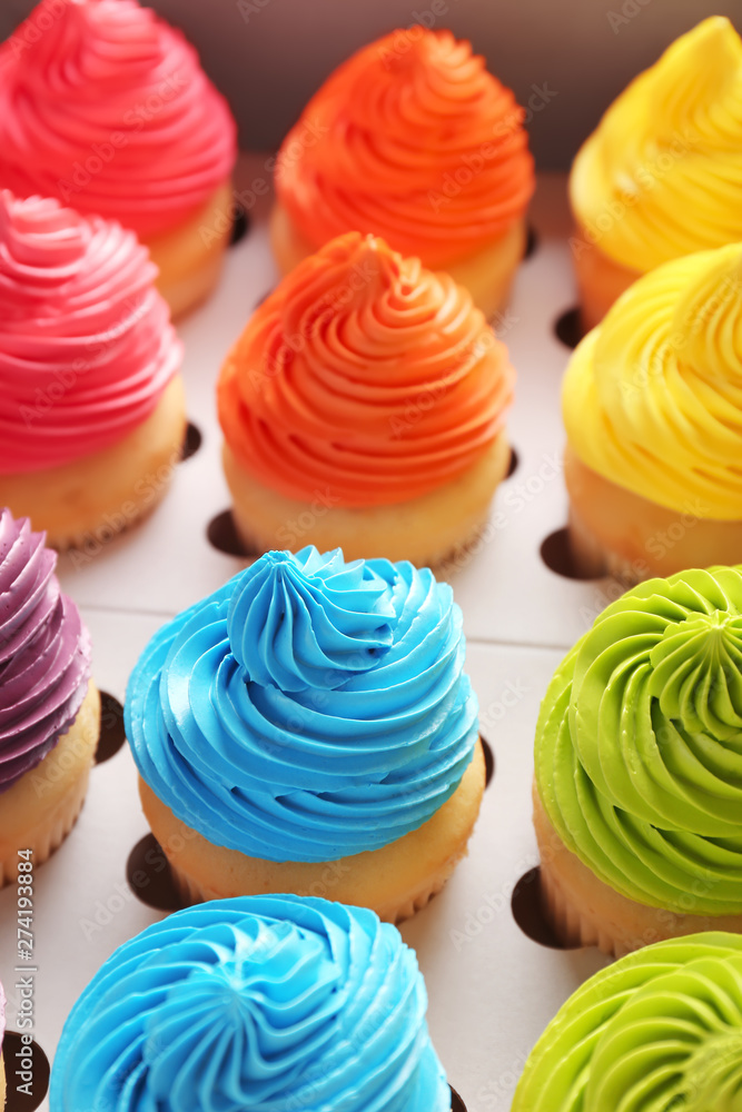 Many tasty colorful cupcakes in box Many tasty colorful cupcakes in box