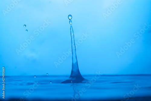 Drop of water. Blue water drop. Water splash close-up.