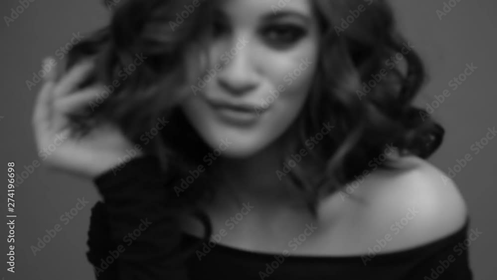 Brunette posing on camera. Black and white video. Emotions girls with a slight flirtation. Brunette posing on camera. Black and white video. Emotions girls with a slight flirtation.