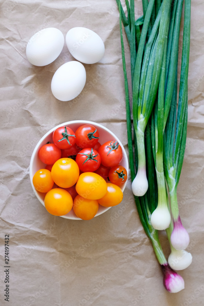 Fresh vegetables for salad on a kitchen table. Fresh vegetables for salad on a kitchen table.