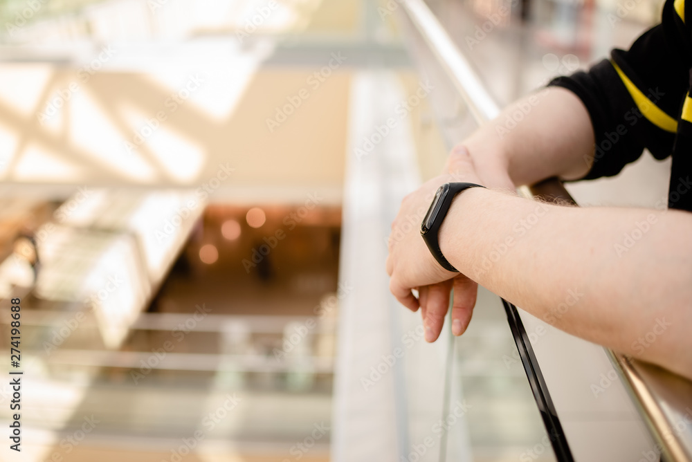 Man is wearing a fitness bracelet. Smart watch on the hand of a man. Pensioner Using Fitness Tracker. Man is wearing a fitness bracelet. Smart watch on the hand of a man. Pensioner Using Fitness Tracker.