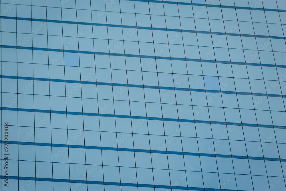 Blue glass windows of office building Blue glass windows of office building
