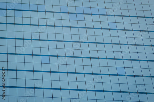 Blue glass windows of office building