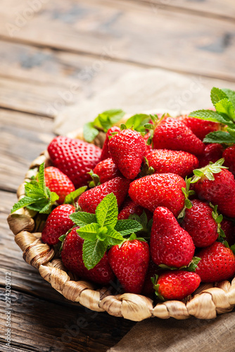 Summer sweet red strawberry on the wooden table