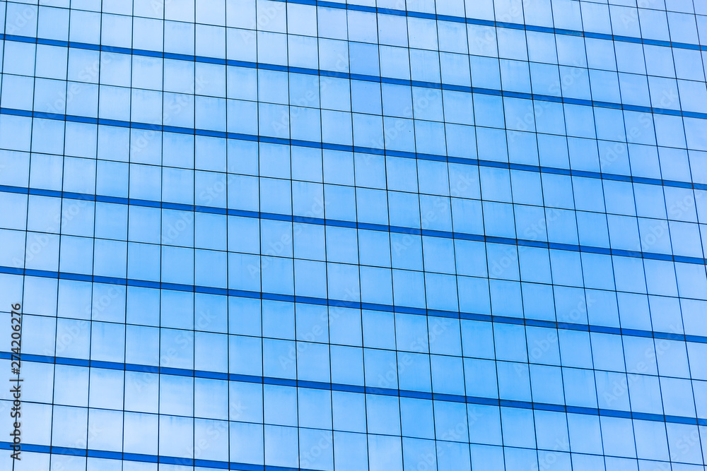 Blue glass windows of office building Blue glass windows of office building