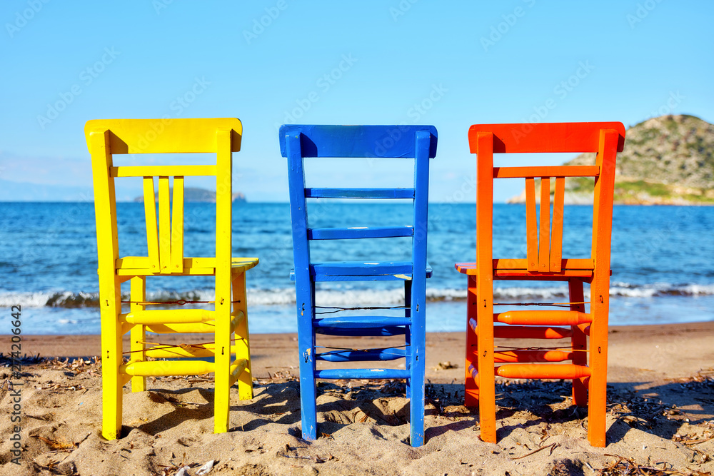 Retro wooden colorful chairs on the beach Retro wooden colorful chairs on the beach