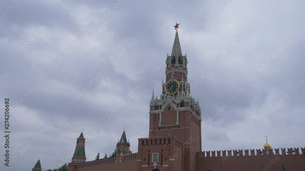 Spasskaya Tower on Red Square under a gloomy sky on a gray cloudy day Spasskaya Tower on Red Square under a gloomy sky on a gray cloudy day