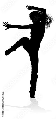 A woman street dance hip hop dancer in silhouette