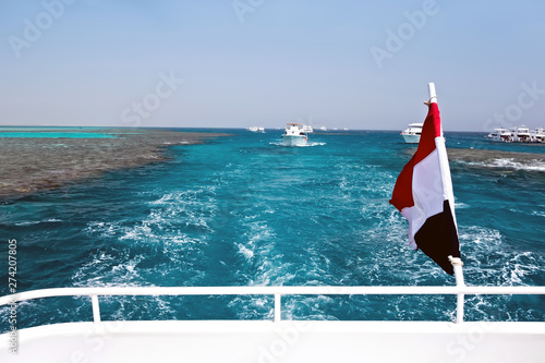 Egypt flag blowing in the wind on white yachts.