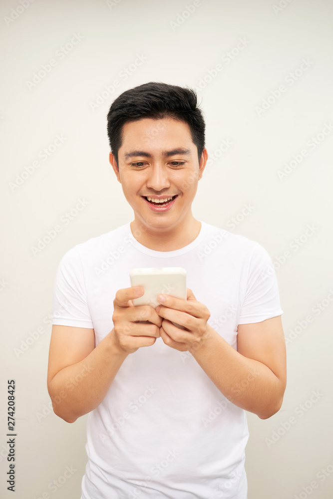 Asian young man use of the cellphone Asian young man use of the cellphone