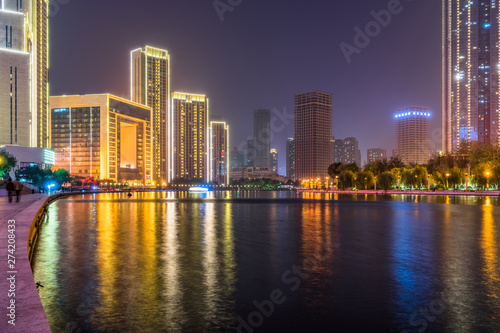 illuminated city waterfront downtown skyline with Haihe river,Tianjin,China. © hallojulie