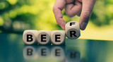 Beer and Beef. Hand turns a cube and changes the word 