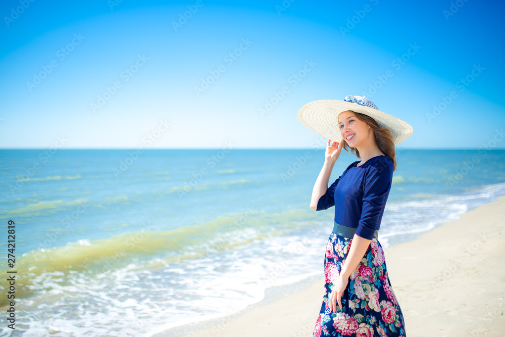 Beautiful girl in a dress on the beach, fashion woman, sea, sunny island