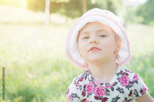 Photo of smiling little child girl in the park