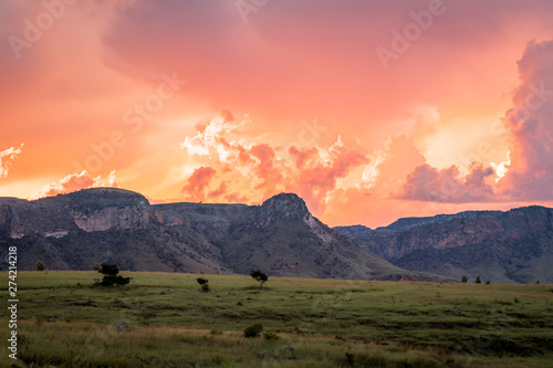 Isalo National Park, Madagascar. Incredible clouds and colors in the sky above the famous rock formation with grass plain  on the foreground