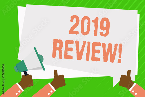 Conceptual hand writing showing 2019 Review. Concept meaning remembering past year events main actions or good shows Hand Holding Megaphone and Gesturing Thumbs Up Text Balloon photo