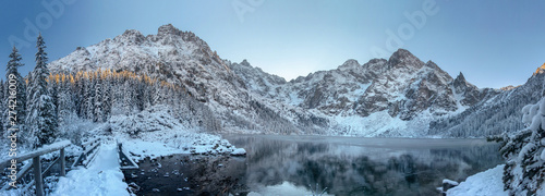 Winter mountains. Scenic frosty mountain landscape. Mountain icy lake. Winter panorama of Tatra mountains in Morskie Oko lake, Poland © dzmitrock87