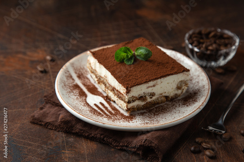 Tiramisu. Traditional italian dessert on white plate photo