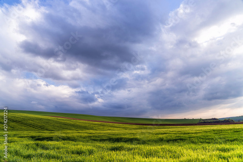 Scenic view of beautiful country landscape. Clouds passing above rural fields in South Moravia  Czech Republic.